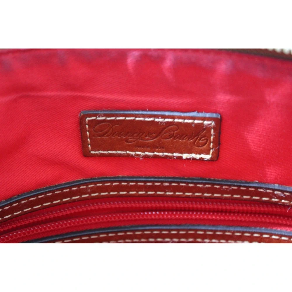 Dooney & Bourke Black Pebbled Leather Crossbody Bag with Tan Trim and Red Lining
